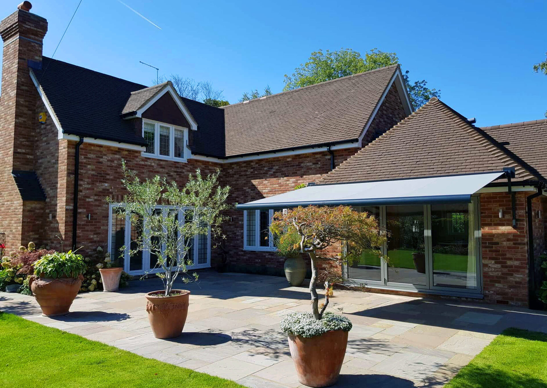 Retractable patio awning in a Yorkshire garden